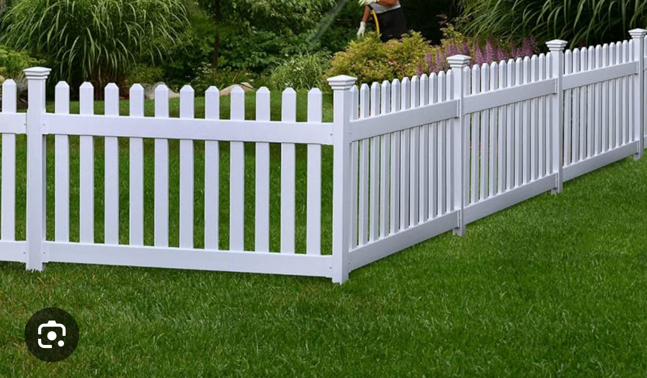 White vinyl picket fence with decorative posts